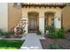 Inviting front entrance with a cozy porch and well-maintained landscaping creates great curb appeal at 21109 W Sunrise Ln, Buckeye, AZ 85396