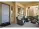 Cozy front porch with seating, creating an inviting outdoor living space with a pleasant ambiance at 21109 W Sunrise Ln, Buckeye, AZ 85396