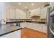 Modern kitchen featuring custom cabinets, sleek countertops, and stainless steel appliances for style and functionality at 21109 W Sunrise Ln, Buckeye, AZ 85396