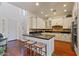 Modern kitchen with sleek countertops, an island, and stainless steel appliances for both style and functionality at 21109 W Sunrise Ln, Buckeye, AZ 85396