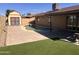 Private backyard with a refreshing swimming pool, artificial turf, and a storage shed at 2130 W Devonshire St, Mesa, AZ 85201
