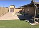 Lovely backyard pool with a storage shed and artificial turf lawn at 2130 W Devonshire St, Mesa, AZ 85201