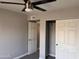 Neutral-toned bedroom featuring fan and closet at 2130 W Devonshire St, Mesa, AZ 85201