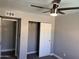 Bedroom with fan and closet at 2130 W Devonshire St, Mesa, AZ 85201