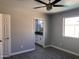 Spacious bedroom with ceiling fan and ensuite bathroom at 2130 W Devonshire St, Mesa, AZ 85201