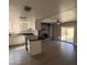 Spacious kitchen seamlessly blends with the living area, featuring dark countertops and modern appliances at 2130 W Devonshire St, Mesa, AZ 85201