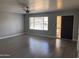 Bright and airy living room with modern flooring, fresh paint, and abundant natural light at 2130 W Devonshire St, Mesa, AZ 85201