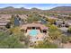 Exceptional aerial view showcasing the community pool, spa, and well-maintained landscaping at 2145 N 88Th St, Mesa, AZ 85207