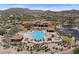 Community aerial featuring a stunning pool area with lounge chairs, spa, and desert landscaping at 2145 N 88Th St, Mesa, AZ 85207