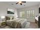 Cozy bedroom featuring neutral colors, comfortable bedding, and two windows at 2145 N 88Th St, Mesa, AZ 85207