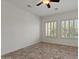 Bedroom featuring neutral walls, tile flooring, and multiple windows with natural light at 2145 N 88Th St, Mesa, AZ 85207