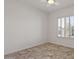 Bright bedroom with tile floors, a ceiling fan, and shuttered windows letting in natural light at 2145 N 88Th St, Mesa, AZ 85207