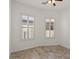 Bright bedroom with tile floors and shuttered windows letting in natural light at 2145 N 88Th St, Mesa, AZ 85207