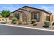 Charming single-story home featuring manicured landscaping, a neutral color palette, and inviting curb appeal at 2145 N 88Th St, Mesa, AZ 85207