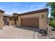 Attached two-car garage with a private gate and landscaped yard at 2145 N 88Th St, Mesa, AZ 85207