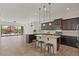 Open concept kitchen features modern appliances and island with seating at 2145 N 88Th St, Mesa, AZ 85207