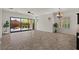 Bright living room featuring large sliding glass doors leading to an outdoor living space at 2145 N 88Th St, Mesa, AZ 85207