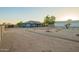 Wide backyard with trees around perimeter and clear views at 22626 W Gibson Ln, Buckeye, AZ 85326