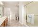 Bathroom featuring a tiled floor and a glass-enclosed shower with a towel bar at 22626 W Gibson Ln, Buckeye, AZ 85326