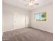 Bright bedroom features neutral tones, natural light, and a sliding closet door at 22626 W Gibson Ln, Buckeye, AZ 85326