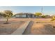 Inviting single-story home with a well-maintained desert front yard at 22626 W Gibson Ln, Buckeye, AZ 85326