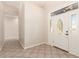 Bright foyer featuring tile floors and a decorative door at 22626 W Gibson Ln, Buckeye, AZ 85326
