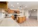 Kitchen with wood cabinets, tile flooring and stainless appliances at 22626 W Gibson Ln, Buckeye, AZ 85326