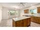 Kitchen island with tile flooring and an attached dining area at 22626 W Gibson Ln, Buckeye, AZ 85326