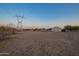 Large lot with utility lines and steel building at 22626 W Gibson Ln, Buckeye, AZ 85326