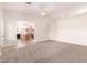 Spacious living room featuring neutral carpet and views into the open kitchen at 22626 W Gibson Ln, Buckeye, AZ 85326
