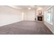 Bright living room with a fireplace and neutral carpet at 22626 W Gibson Ln, Buckeye, AZ 85326