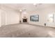 Spacious living room featuring a fireplace and carpet floors at 22626 W Gibson Ln, Buckeye, AZ 85326