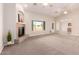Spacious living room featuring a fireplace and large windows at 22626 W Gibson Ln, Buckeye, AZ 85326