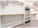 Walk-in closet with ample shelving, custom organizers, and plenty of storage space at 22626 W Gibson Ln, Buckeye, AZ 85326