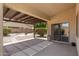 Backyard featuring a covered patio, brick pavers, decorative shrubbery, and a charming fire pit at 2329 E Ebony Dr, Chandler, AZ 85286