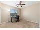 Bedroom showcasing a work station with an adjustable height desk, comfortable chair, and modern computer setup at 2329 E Ebony Dr, Chandler, AZ 85286