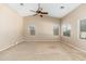 Spacious bedroom with vaulted ceiling, neutral walls, and several windows for natural light at 2329 E Ebony Dr, Chandler, AZ 85286