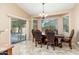 Dining area featuring a chandelier, sliding glass doors, and a formal dining set at 2329 E Ebony Dr, Chandler, AZ 85286