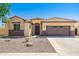 Charming single-story home featuring a two-car garage, neutral stucco, and decorative stone accents at 2329 E Ebony Dr, Chandler, AZ 85286