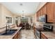 Open kitchen with a dining area, stainless steel appliances, and tile flooring at 2329 E Ebony Dr, Chandler, AZ 85286