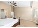 Spacious main bedroom with neutral tones, a ceiling fan, and carpeted flooring at 2329 E Ebony Dr, Chandler, AZ 85286