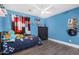 Bright bedroom with ceiling fan and playful decor at 23848 W Grove St, Buckeye, AZ 85326