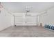 Spacious garage with an automatic door and room for storage and parking with a basketball hoop at 23848 W Grove St, Buckeye, AZ 85326