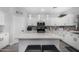 Bright kitchen with center island and seating, stainless appliances, and modern cabinetry at 23848 W Grove St, Buckeye, AZ 85326