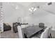Spacious living room and dining area featuring neutral walls, and modern decor and finishes at 23848 W Grove St, Buckeye, AZ 85326