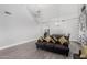 Cozy living room space with gray couches, a gray dining table, and tall ceilings at 23848 W Grove St, Buckeye, AZ 85326
