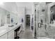 Modern main bathroom features tiled shower, dual sinks, makeup vanity, and closet at 23848 W Grove St, Buckeye, AZ 85326