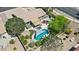 Stunning aerial view of backyard oasis with pool, hot tub, fire pit, and lush landscaping, perfect for outdoor entertaining at 2585 E Morgan Dr, Gilbert, AZ 85295
