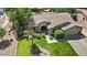 Beautiful home featuring a tile roof, lush landscaping, and backyard pool at 2585 E Morgan Dr, Gilbert, AZ 85295