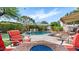 Outdoor oasis with a pool, fire pit, and comfortable seating, creating a perfect entertaining space at 2585 E Morgan Dr, Gilbert, AZ 85295
